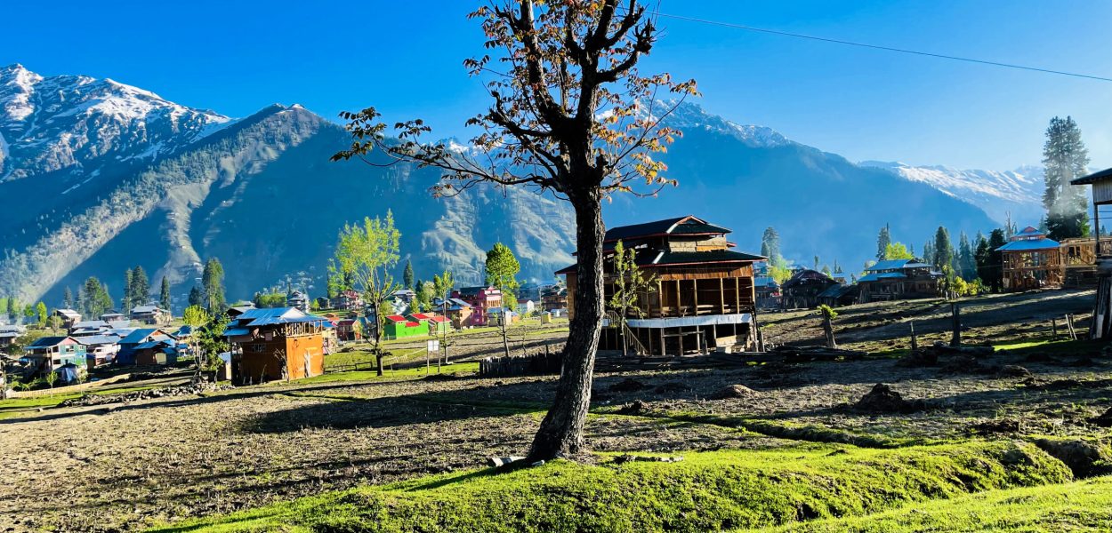 beautiful-landscape-arang-kel-kashmir-with-green-fields-local-houses-with-hidden-clouds
