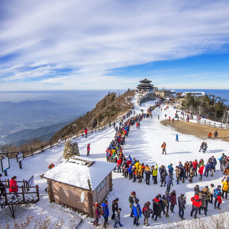 DEOGYUSAN,KOREA - JANUARY 1: Tourists taking photos of the beautiful scenery and skiing around Deogyusan,South Korea on January 1, 2016.