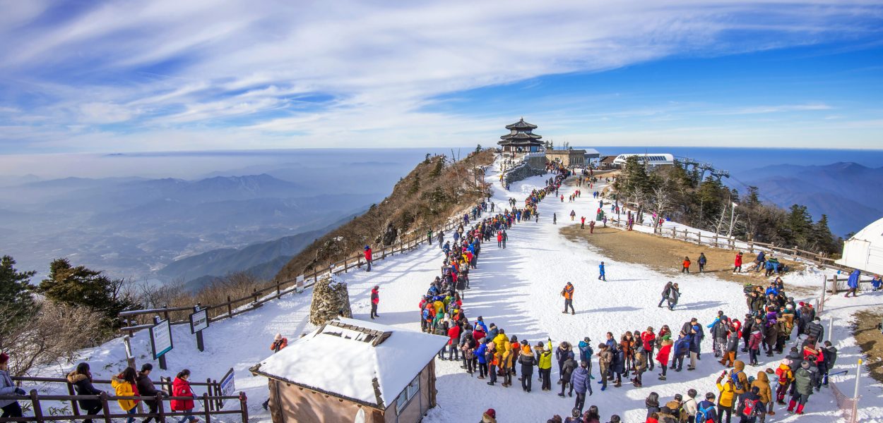 DEOGYUSAN,KOREA - JANUARY 1: Tourists taking photos of the beautiful scenery and skiing around Deogyusan,South Korea on January 1, 2016.